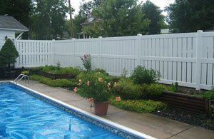 Poly vinyl fence around residential swimming pool